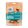 Super Smarty Hearties dog treats with a bag of treats, a silhouette of a dog, and close-ups of food and a sign.